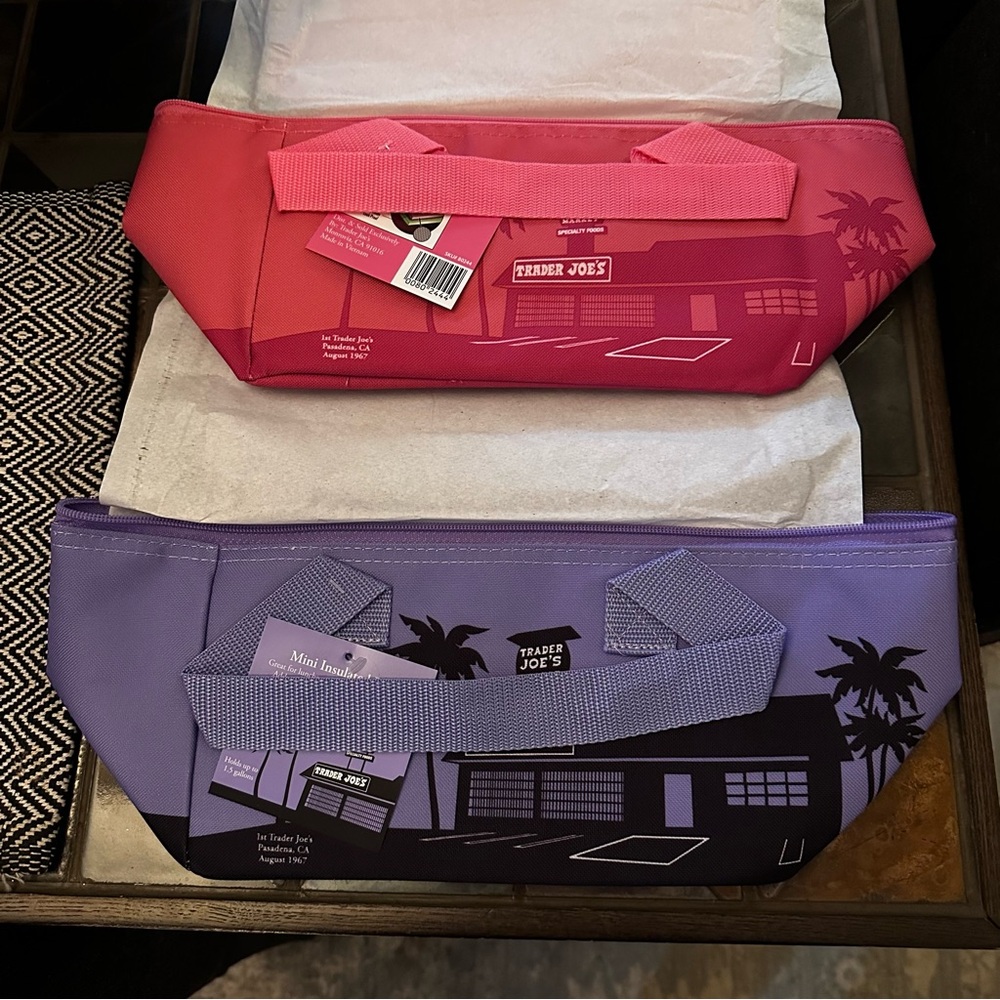 Two Trader Joe’s bags, pink and lavender